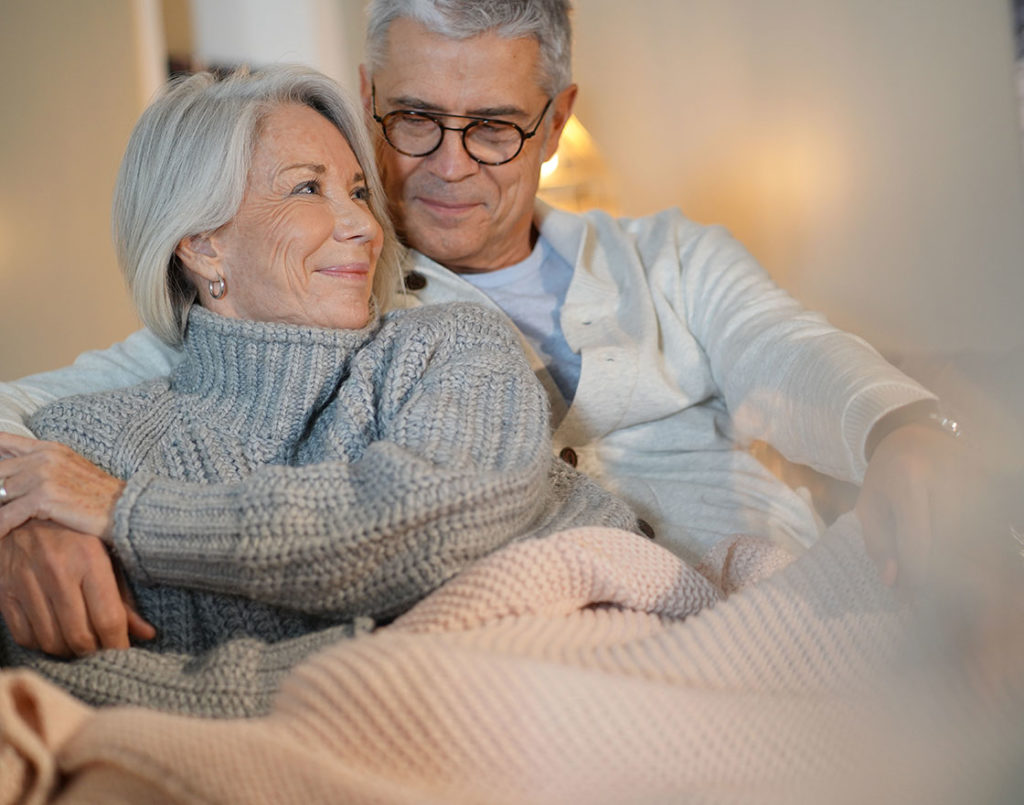 elderly couple warm inside their home