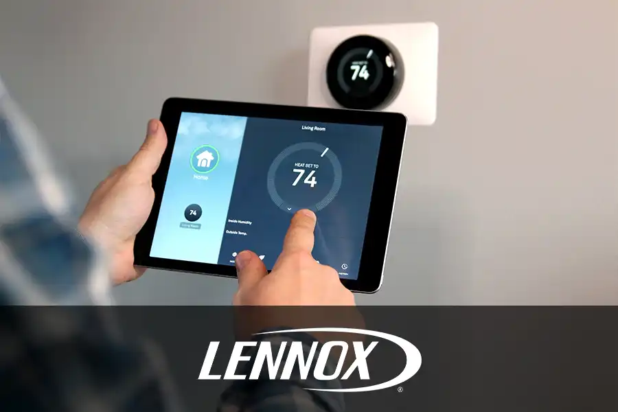 Bormida Heating & Cooling—Man adjusts the temperature using a tablet with smart home app in modern living room in Springfield, IL.