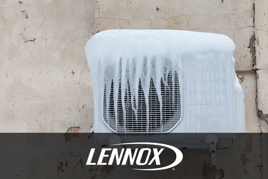 Bormida Heating & Cooling—An outdoor air conditioner with ice and icicles on a home in Springfield, IL.