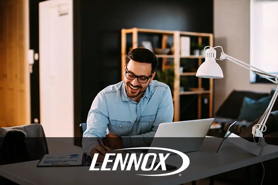 Bormida Heating & Cooling—A male homeowner works happily in his home office in Springfield, IL.