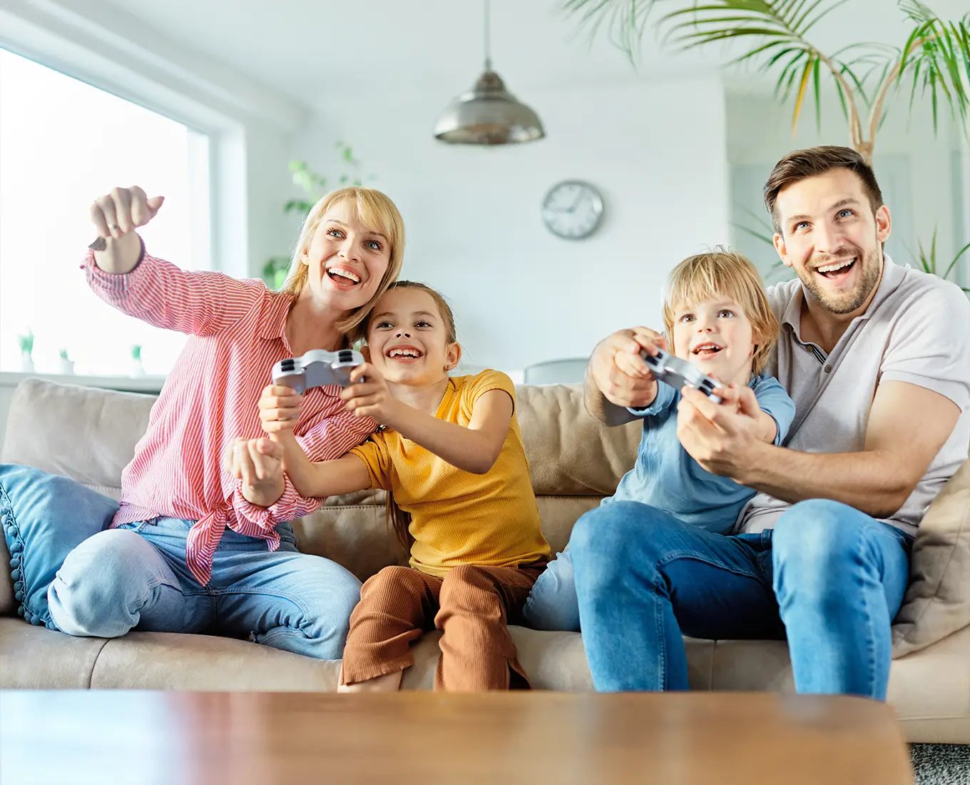 Family enjoying a comfortable living room thanks to reliable 24/7 HVAC service keeping their home cool and comfortable in Springfield, IL.