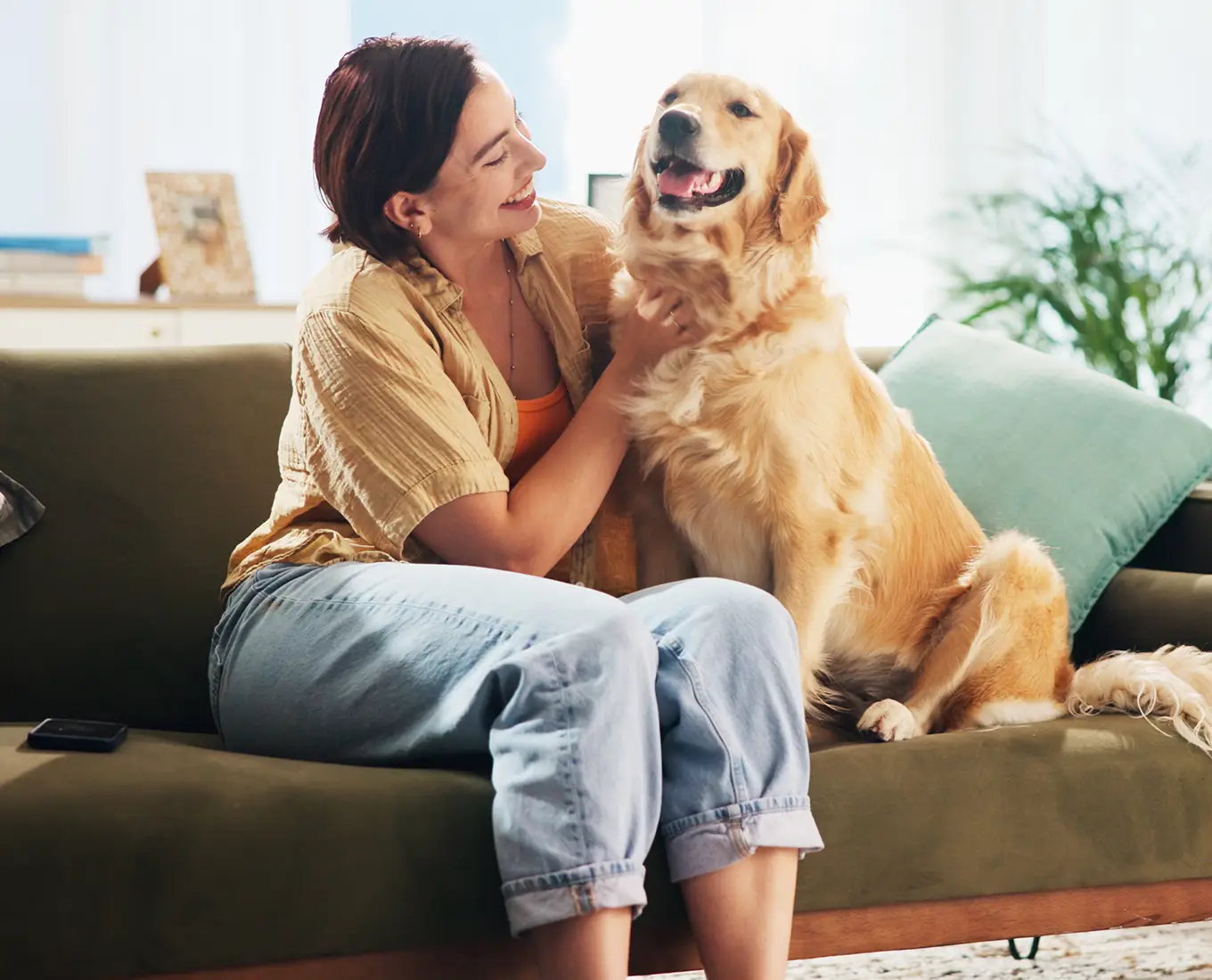 Homeowner relaxing comfortably with her dog after fast 24/7 HVAC service restored cooling in her Springfield, IL home.