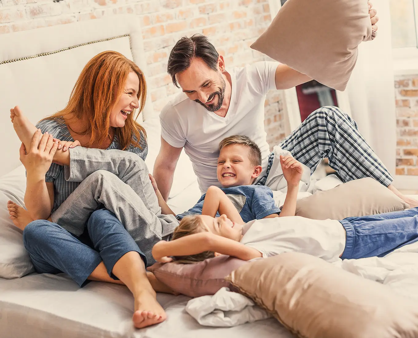 Family enjoying a cool and comfortable bedroom thanks to reliable AC repair and air conditioning services in Springfield, IL.