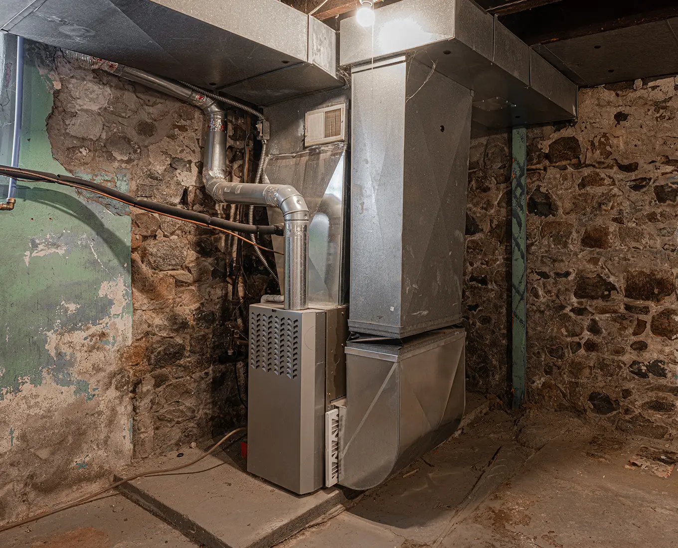 Residential furnace system installed in a basement as part of a furnace replacement project by Bormida Heating & Cooling in Springfield, IL.