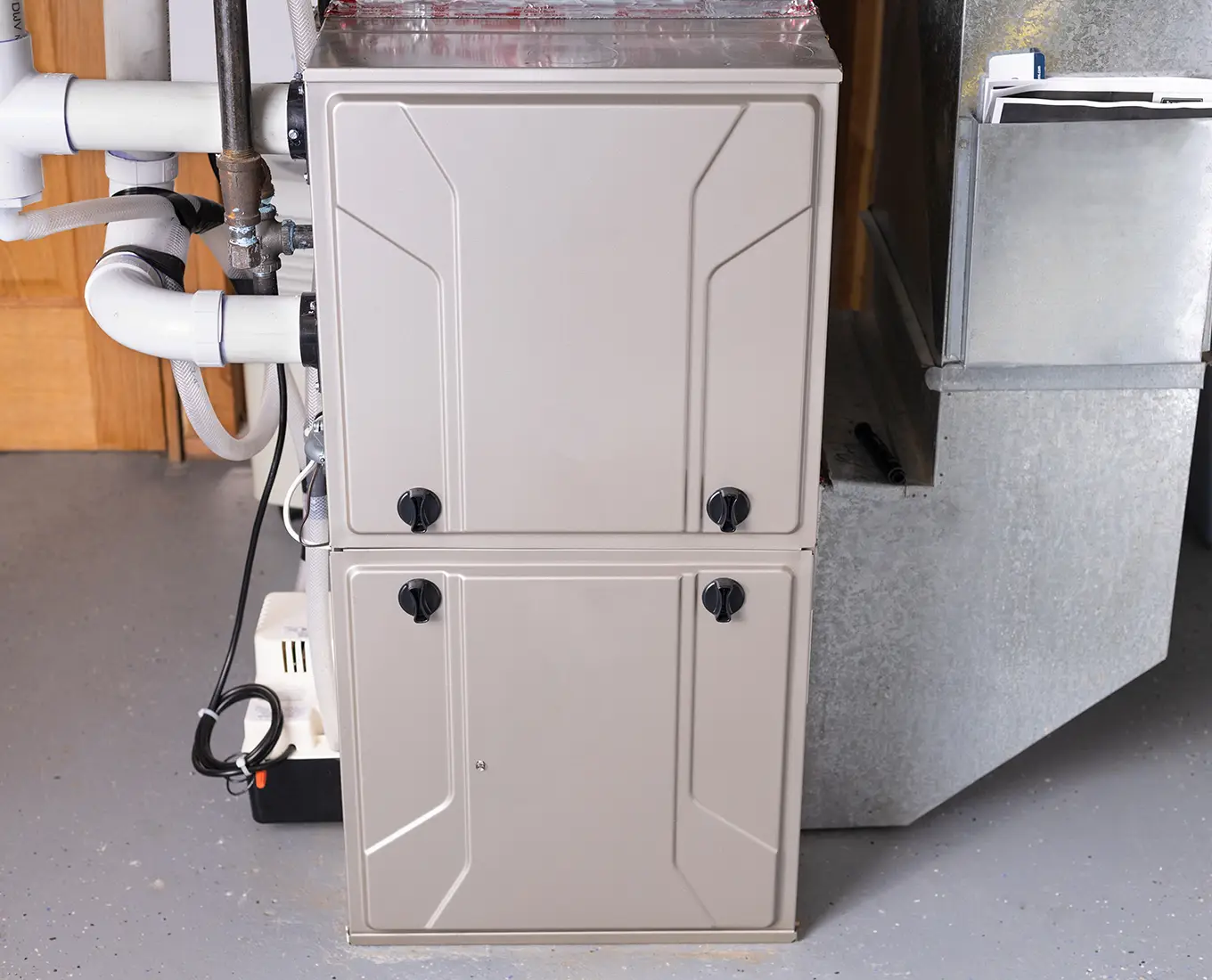 New high-efficiency furnace installed in a home utility area by Bormida Heating & Cooling providing furnace installation services in Springfield, IL.