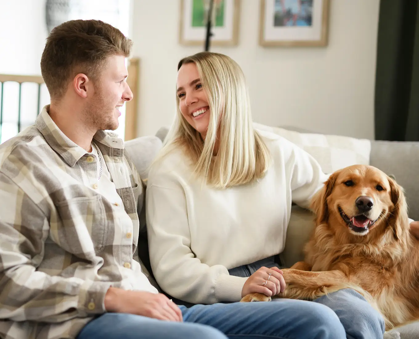 Homeowners relaxing comfortably with their dog after furnace repair service from Bormida Heating & Cooling in Springfield, IL.