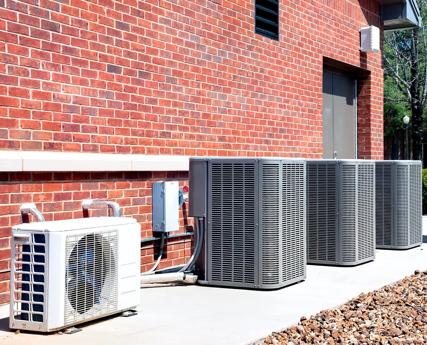 energy efficient Commercial HVAC systems installed along brick building for business heating and cooling in Springfield, IL