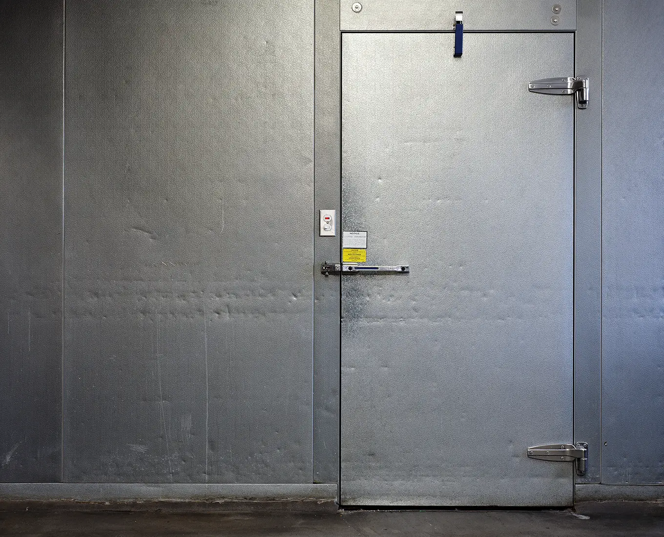 Heavy-duty walk-in cooler door for commercial cold storage maintained by professional commercial refrigeration service technicians in Springfield, IL.