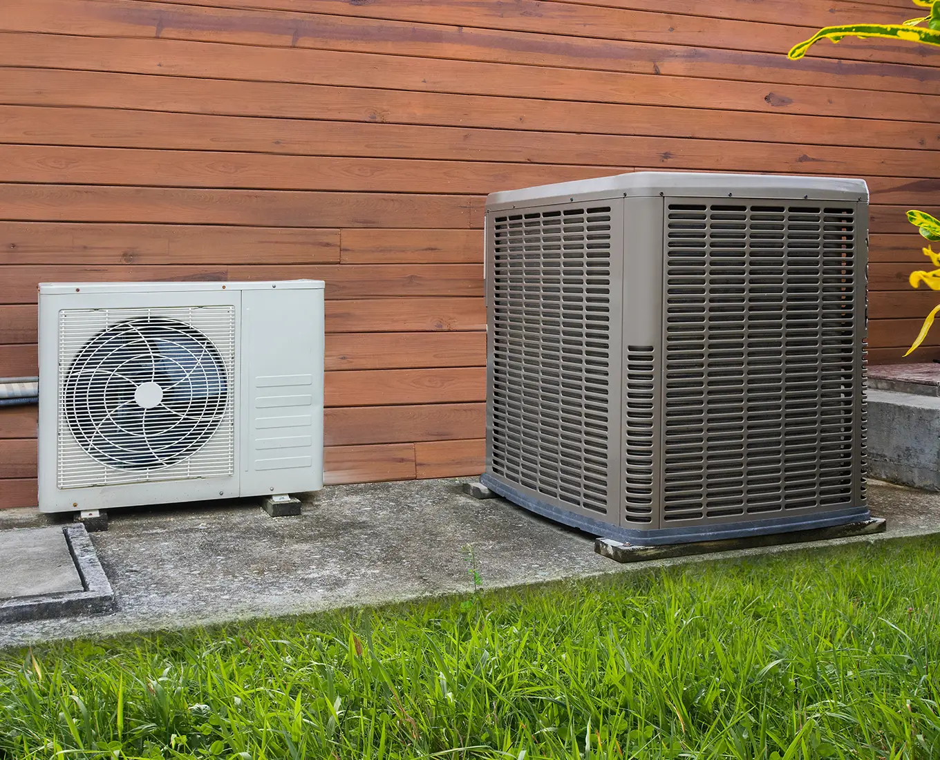 Outdoor heat pump units installed beside a home for energy-efficient heating and cooling in Springfield, IL