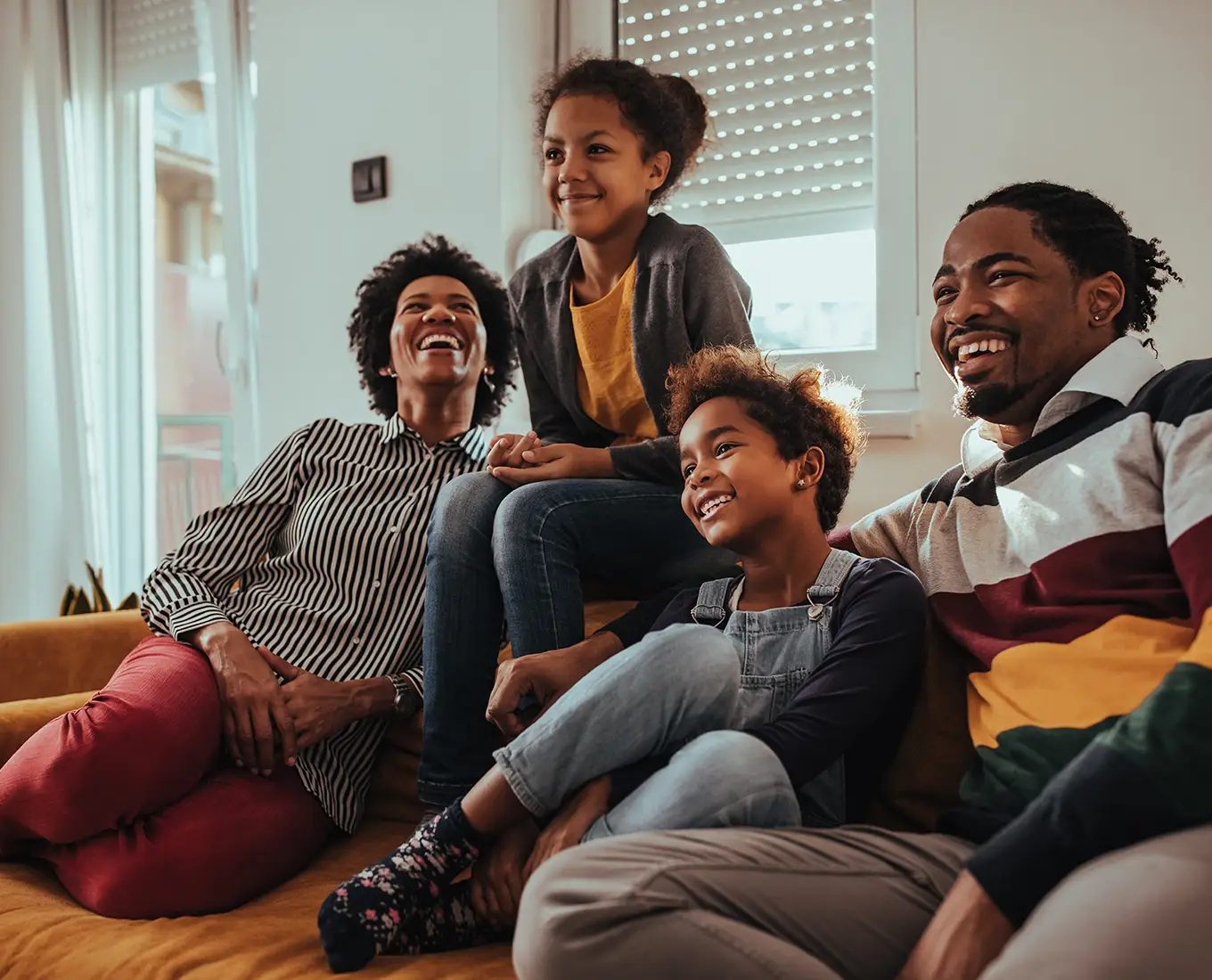 Family enjoying a comfortable home with improved indoor air quality from furnace maintenance in Springfield, IL