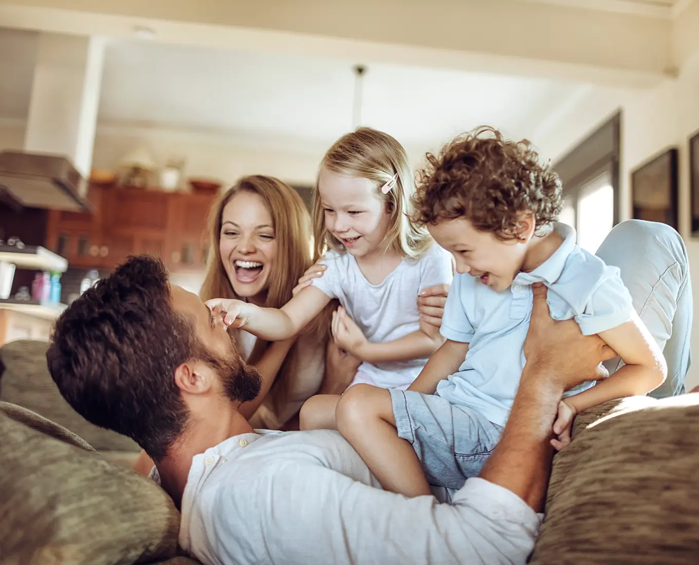 Family relaxing in a comfortable home powered by energy efficient geothermal heating and cooling in Springfield IL