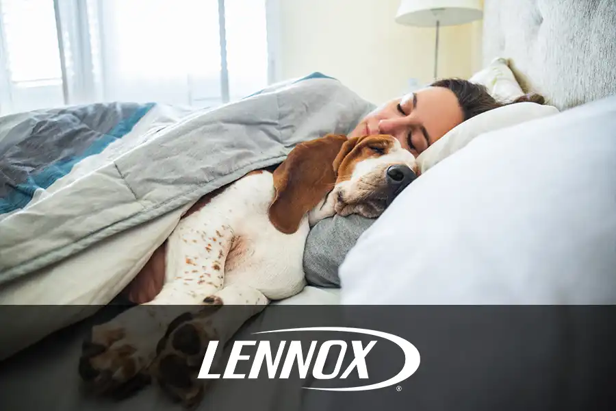 Bormida Heating & Cooling—A young female homeowner sleeps next to her dog in a comfortable, air conditioned room in Springfield, IL.