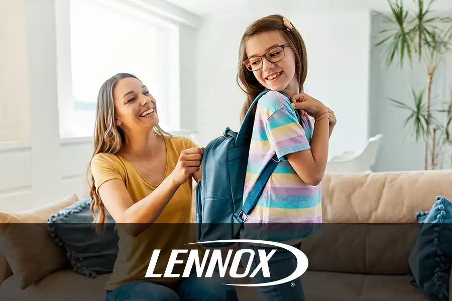 Bormida Heating & Cooling—A mom helps her daughter with her backpack as she gets ready to go back to school in Springfield, IL.